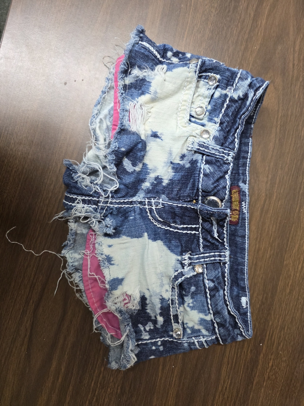 Distressed Blue Tie-Dye Denim Shorts with Pink Lining